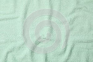 Green towel textured background, close up