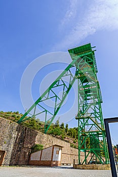 Green tower of a well extraction of a mine of salt or potash in disuse.