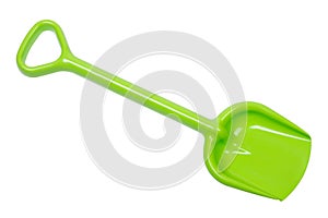 Green toy spade, plastic shovel