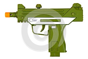 Green toy submachine gun on a white background, isolated image