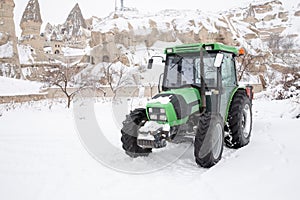 Green tractor in winter in Cappadocia