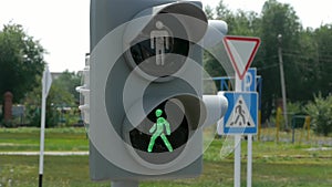 Green traffic light with colorful unfocused lights on a background