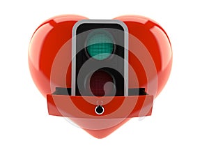 Green traffic light inside heart