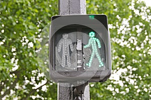 Green traffic light signal sign in street