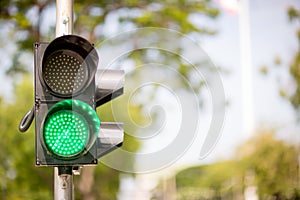 Green Traffic lights, traffic sign for pedestrians on background.sign of ready cross.