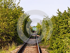 Green train on the horizin photo