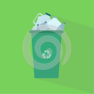 Green trash can full of plastic bottles on green background