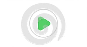 A green triangular play button centered within a gray circle on a white background. The