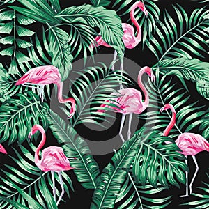 Green tropical leaves and pink flamingo seamless pattern black background