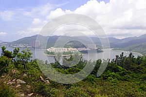 Green Tropical mountains and hiking route on the Dragon's Back trail near Hong Kong