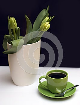 Green tulips and coffee