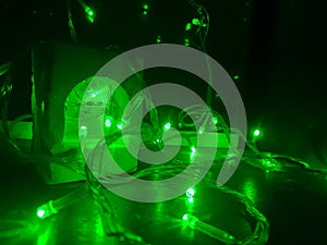 Green tumblr lamp in the night photo