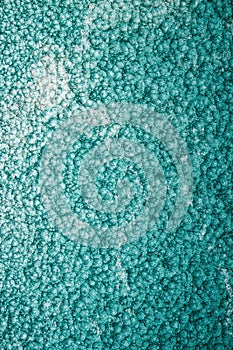 Green or turquoise hammered metal background,abstract metalic texture, sheet of metal surface painted with hammer paint