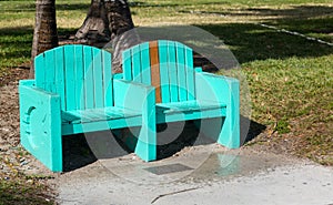 Green turquoise street bench in Miami beach