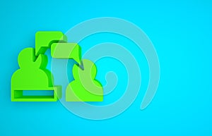 Green Two sitting men talking icon isolated on blue background. Speech bubble chat. Message icon. Communication or