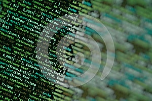 Green unique background. Programming language on laptop computer screen. Program code PHP HTML JavaScript of site. Computer code o