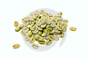 Green unroasted coffee beans isolated over white