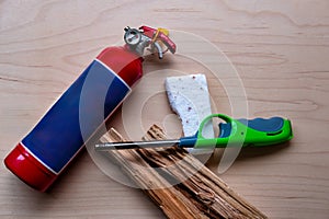 Green Utility Lighter and Firelighter Brick on Wooden Surface