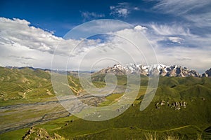 Green valley of Aksay with the snowy At Bashi Mountains, Kyrgyzstan