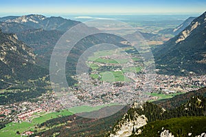 Green valley with small town in Alps mountains