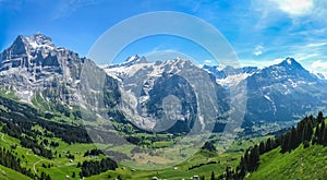 Green valley in the Swiss Alps photo