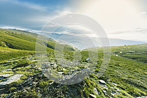 Green valley under blue sky