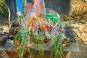 Season of delicious charcoal grilled calsots photo