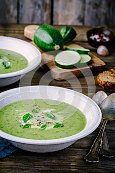 Green vegetable cream soup puree with zucchini and basil