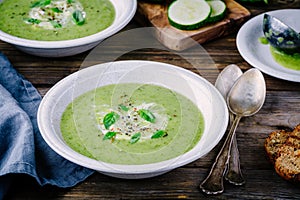 Green vegetable cream soup puree with zucchini and basil