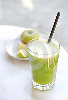 Green vegetable juice outdoors made from apples.