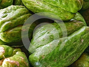 A green vegetable of the pumpkin variety, popularly known as chayote.