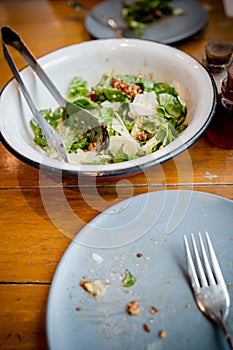 Green vegetable salad with parmesan cheese toppings in a bowl