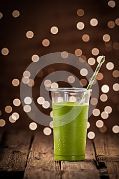 Green vegetable smoothie with party lights