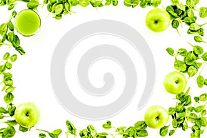 Green vegetables background with vegetable smoothies. Fresh apples, arugula salad on white background top view copy