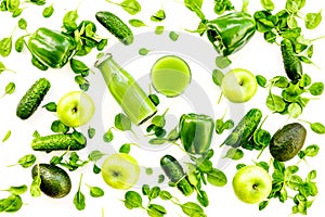 Green vegetables background with vegetable smoothies. Shiny bell pepper, cucumber, arugula salad, avocado and fresh