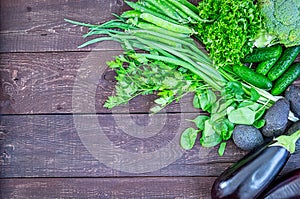 Green Vegetables and Fresh Herbs for Healthy Cooking on Vintage Wooden Table, Diet or Vegetarian Food Concept, Background Layout