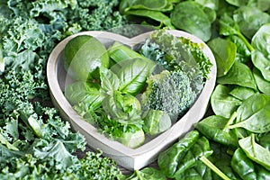 Green vegetables and herbs in heart health concept