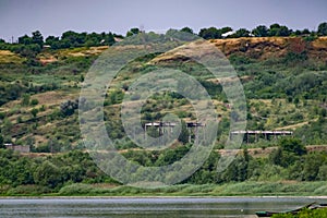 Green vegetation over the don river in the Rostov region in overcast weather. Under a grey, rainy sky. Rare colors of nature in sc