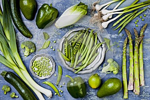 Green veggies group. Vegetarian dinner ingredients. Green vegetables variety. Overhead, flat lay, top view,