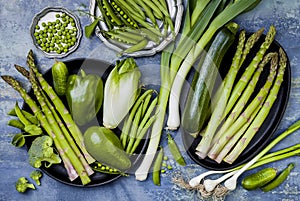 Green veggies group. Vegetarian dinner ingredients. Green vegetables variety. Overhead, flat lay, top view,