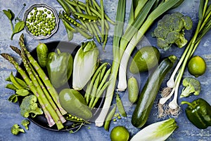 Green veggies group. Vegetarian dinner ingredients. Green vegetables variety. Overhead, flat lay, top view.