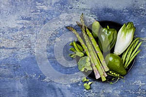 Green veggies group. Vegetarian dinner ingredients. Green vegetables variety. Overhead, flat lay, top view, copy space.