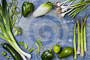 Green veggies group. Vegetarian dinner ingredients. Green vegetables variety. Overhead, flat lay, top view, copy space.
