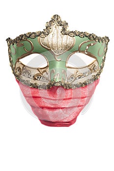 Green venetian mask wearing a red surgical mask, isolated on white background
