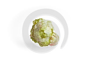 green vesuvianite (also known as idocrase) crystal isolated on white blackground. photo