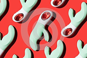 green vibrators pattern for masturbation on a red background