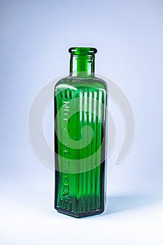 Green victorian home use chemicals bottle, Not to be taken sign, vintage glassware dusty oldtimes common household item