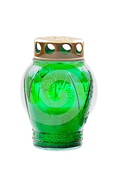 Green votive candle on white background