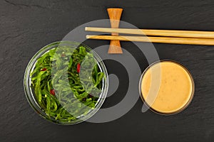 Green wakame seaweed salad with satay sauce