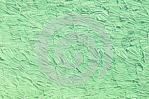 Green wall background with structure of plaster